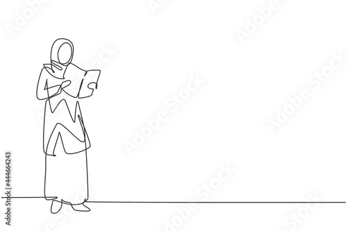 Single continuous line drawing young Arab woman reading, learning and standing in library. Study alone. Intelligent student, education concept. Dynamic one line draw graphic design vector illustration