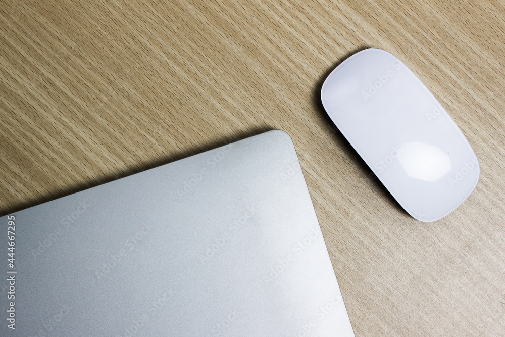 Computer item with mouse on a wooden table. Computer item with mouse on a wooden table.