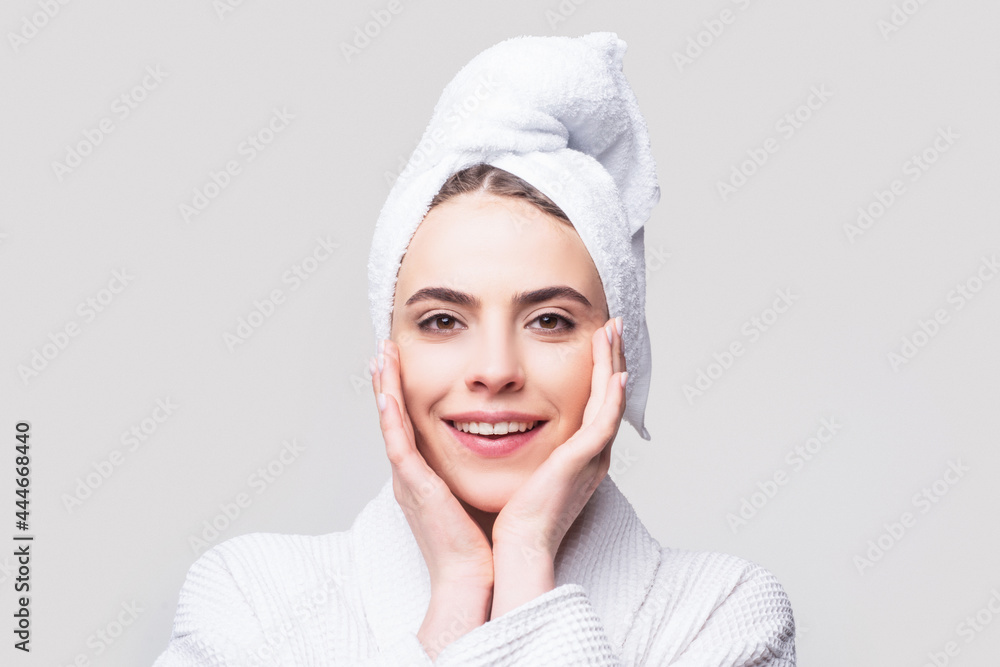 Beauty concept, beauty portrait of young woman with cream on cheek. Portrait view of naturally beautiful woman looking at the camera, cosmetology concept Beauty concept, beauty portrait of young woman with cream on cheek. Portrait view of naturally beautiful woman looking at the camera, cosmetology concept