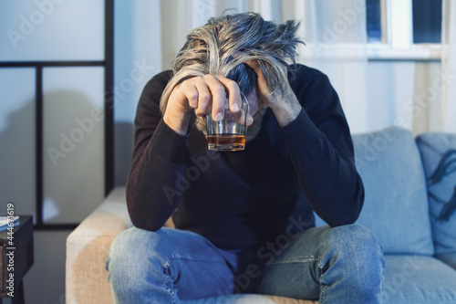 Senior man with glass of dr...