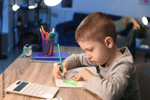 Little boy doing homework a...