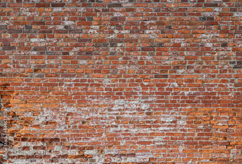 Front view of old and weathered red brick wall. Abstract full frame textured background.