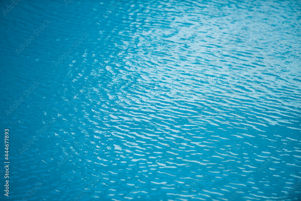 Abstract ripple wave and clear turquoise water surface in swimming pool, blue water wave for background and abstract design. Abstract ripple wave and clear turquoise water surface in swimming pool, blue water wave for background and abstract design.