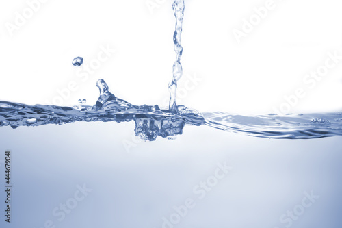 Water splash Aqua flowing in waves and creating bubbles Drops on the water surface feel fresh and clean isolated on white background.