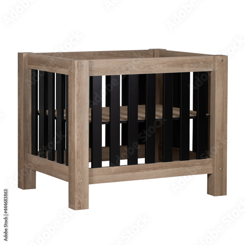 Brown wooden box frame baby bed with black wooden bars on a white background isolated