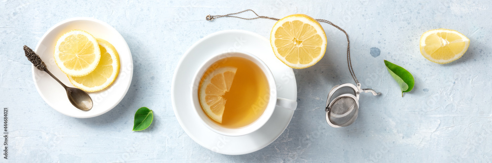 Lemon tea in a cup, overhead flat panorama. Organic lemons, shot from above. Healthy detox citrus drink panoramic header, natural remedy Lemon tea in a cup, overhead flat panorama. Organic lemons, shot from above. Healthy detox citrus drink panoramic header, natural remedy