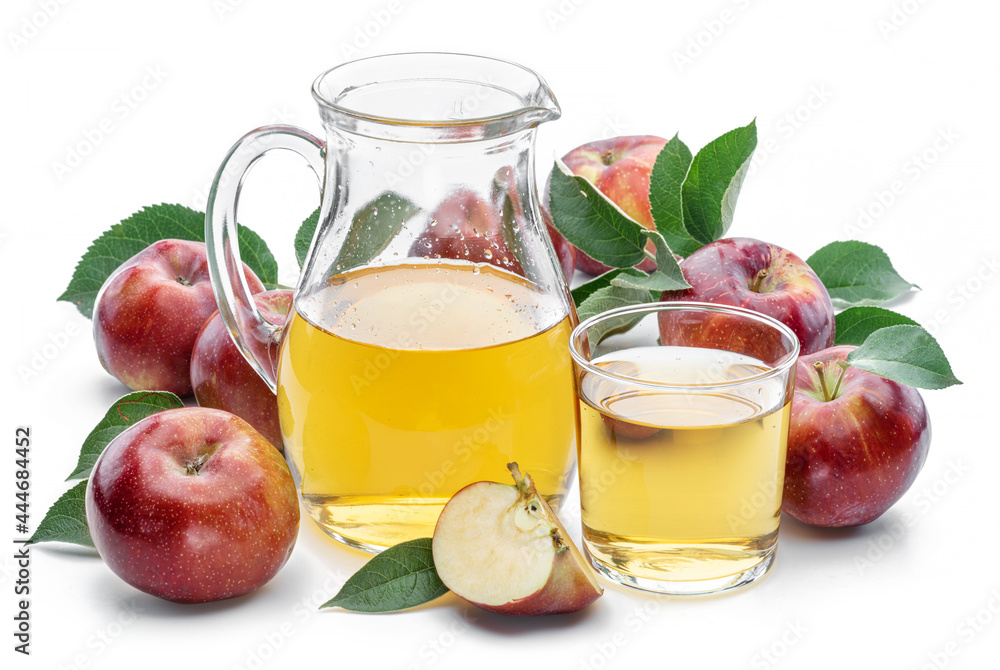 Glass and carafe of fresh apple juice and organic apples isolated on white background. Glass and carafe of fresh apple juice and organic apples isolated on white background.