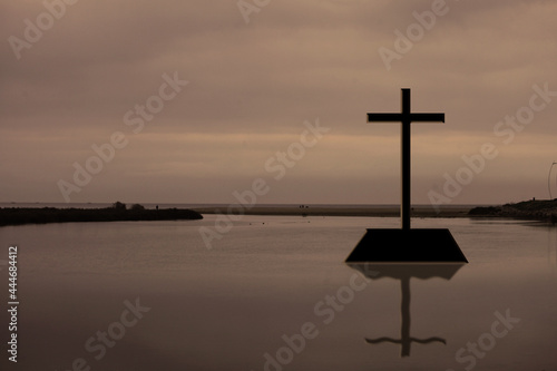 cross on river landscape, Jesus Christ cross symbol  on a water sky , Christian religion resurrection