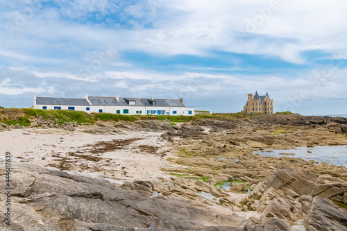 The Turpault castle at Quiberon peninsula, with traditional houses on the coast 