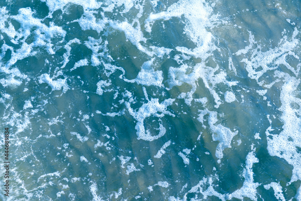 Deep blue and rough sea with lot of sea spray.Blue background.Soft focus,blurred image. Deep blue and rough sea with lot of sea spray.Blue background.Soft focus,blurred image.