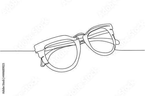 Continuous one line of fashion sunglasses in silhouette on a white background. Linear stylized.Minimalist.