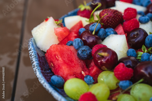 assorted fruits and berries on a plate. summer harvest. 