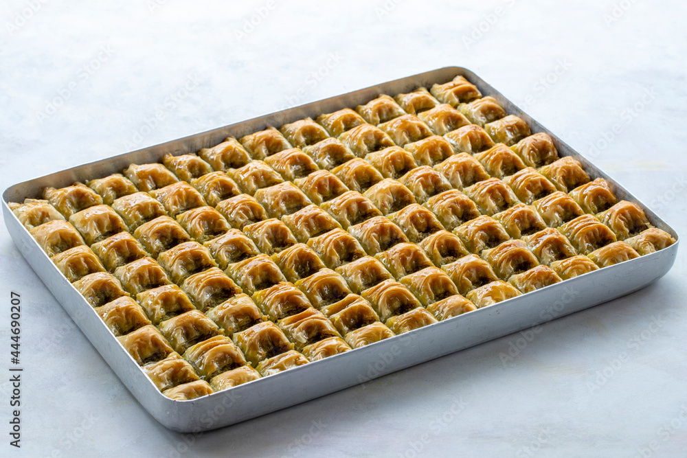 Baklava with pistachio on a white background. Local name cimcik baklava Baklava with pistachio on a white background. Local name cimcik baklava