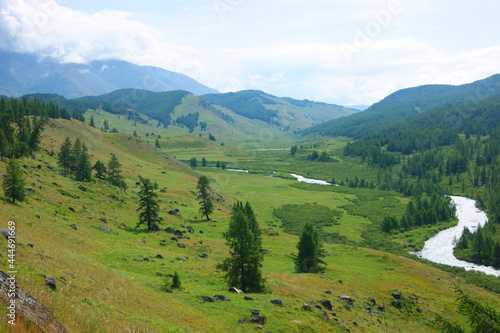 Valley in mountain with stream year daytime