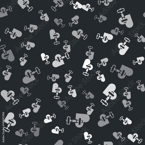 Grey Dumbbell with heart icon isolated seamless pattern on black background. Muscle lifting  fitness barbell  sports equipment. Vector