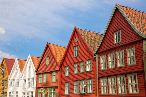Colourful wooden houses of Bryggen the old wharf historic harbour district of Bergen, Norway. Its a Unesco World heritage listed and was rebuilt after being destroyed in a fine.