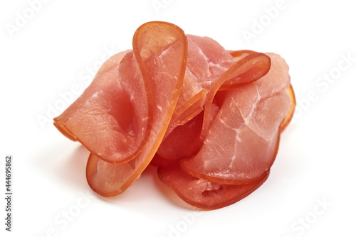 Jerked prosciutto slices, spanish dry-cured ham, isolated on white background. High resolution image.