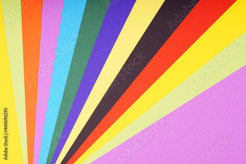 multicolored sheets of paper in fan-shaped pattern background