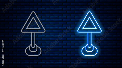 Glowing neon line Triangle warning blank icon isolated on brick wall background. Traffic rules and safe driving. Vector