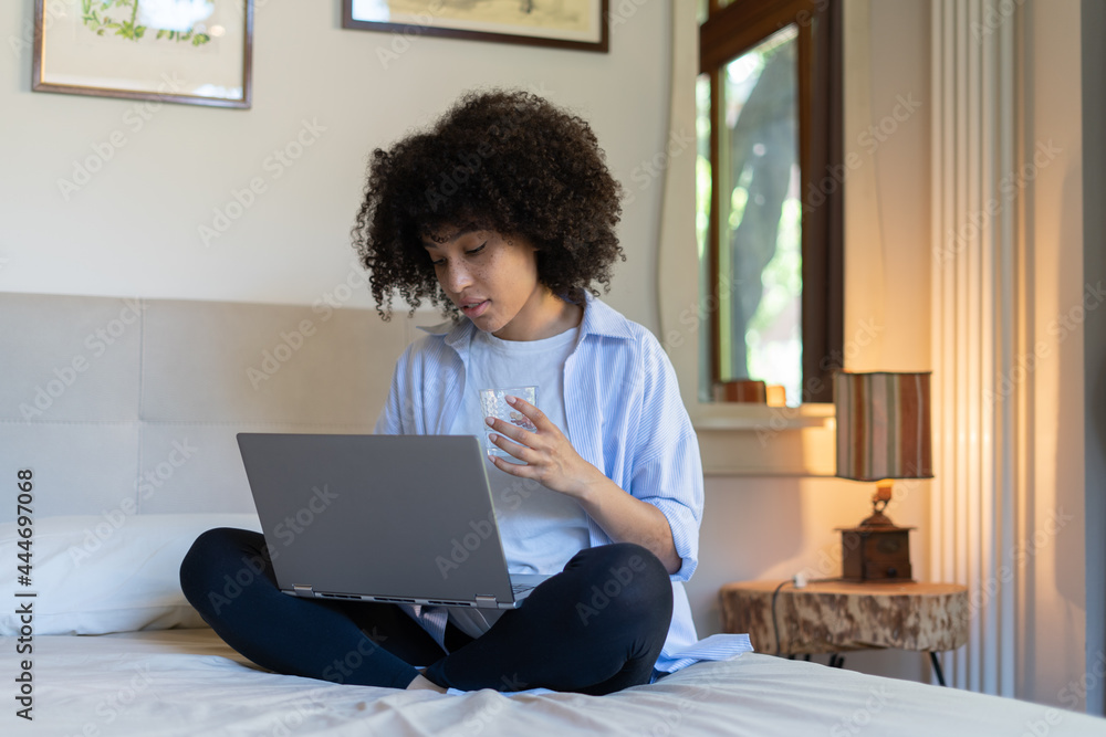 happy african woman at home using laptop, notebook, happy african woman at home using laptop, notebook,