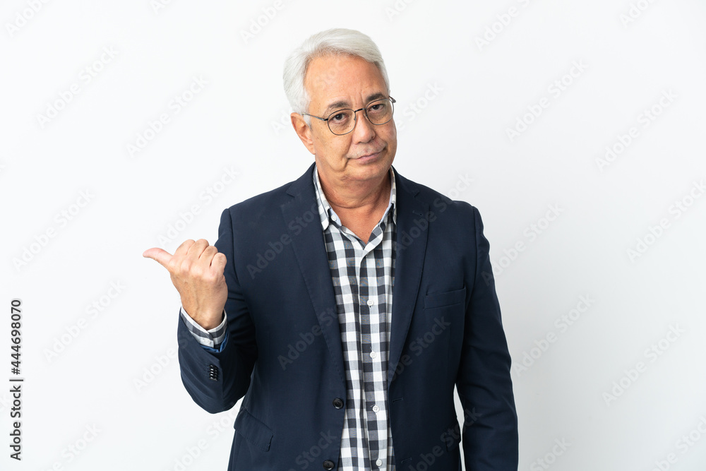 Middle age Brazilian man isolated on white background unhappy and pointing to the side Middle age Brazilian man isolated on white background unhappy and pointing to the side
