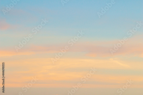 Sunset sky background with pink, purple and blue dramatic colorful clouds, vast sunset sky landscape photo