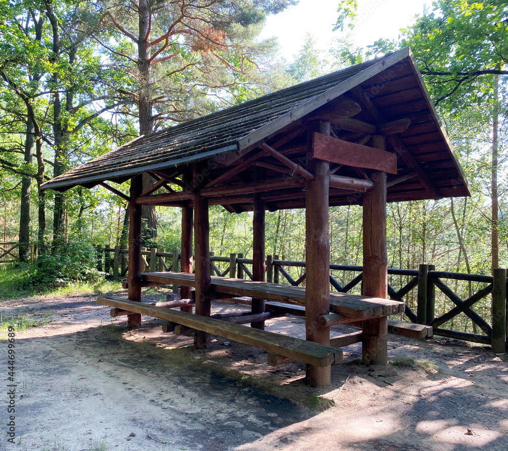 Wooden gazebo for vacationers in the forest Wooden gazebo for vacationers in the forest