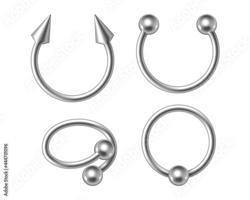 Set of silver piercing jewelry, metal pierce rings, barbell with balls and cones for face and body