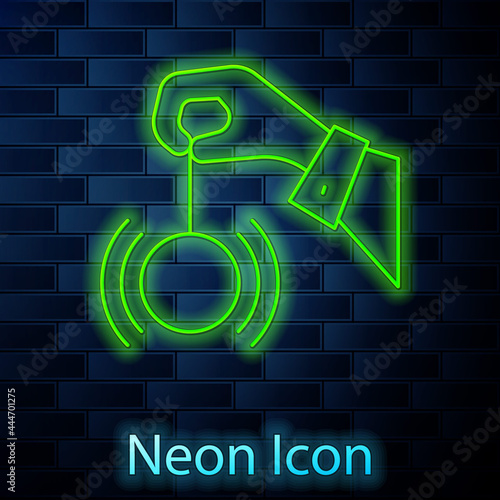 Glowing neon line Hypnosis icon isolated on brick wall background. Human eye with spiral hypnotic iris. Vector