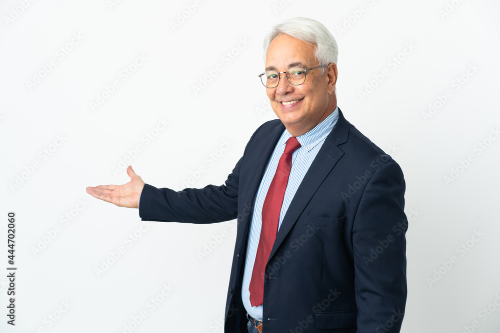 Middle age Brazilian business man isolated on white background extending hands to the side for inviting to come Middle age Brazilian business man isolated on white background extending hands to the side for inviting to come