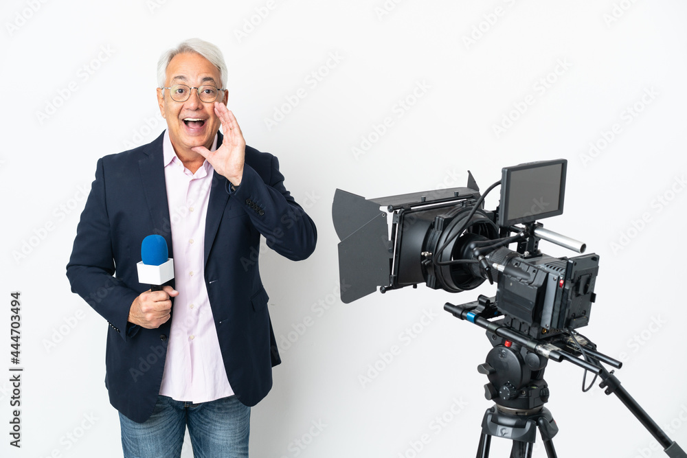 Reporter Middle age Brazilian man holding a microphone and reporting news isolated on white background with surprise and shocked facial expression