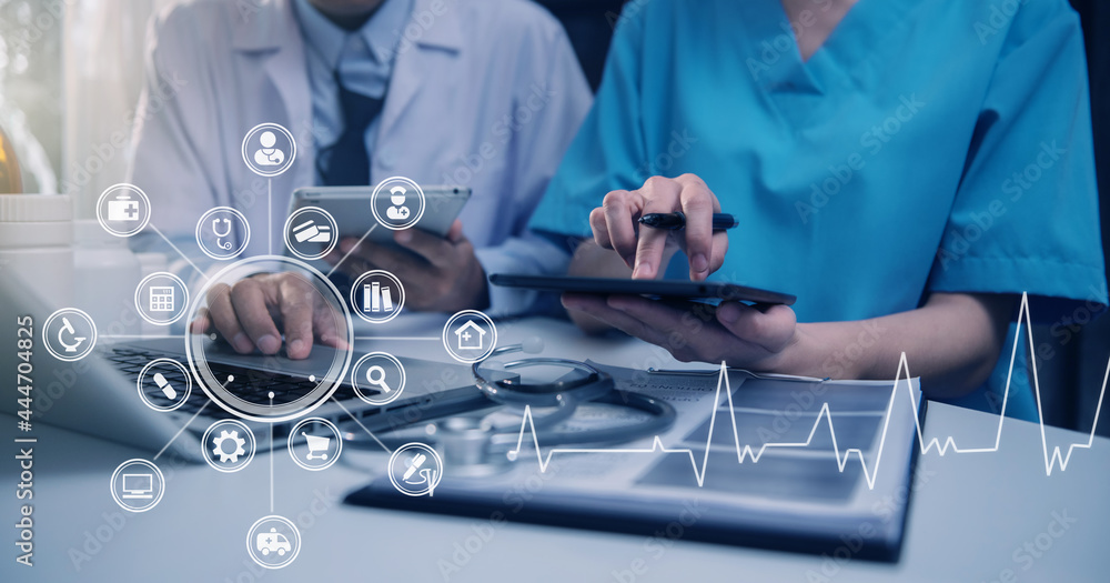 Doctor sitting at table and writing on a document report in hospital office. Medical healthcare staff and doctor service. Doctor sitting at table and writing on a document report in hospital office. Medical healthcare staff and doctor service.