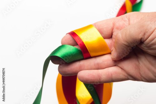 hand with coloured ribbon