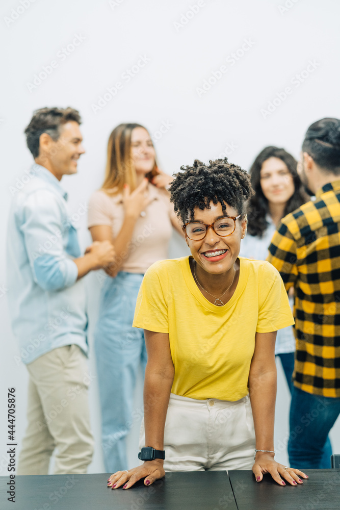 Portrait of office worker smiling to camera in big and creative office in business meeting Portrait of office worker smiling to camera in big and creative office in business meeting