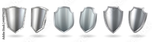 Metal shields set with shadow realistic. Blank silver steel metallic panel with reflection glow