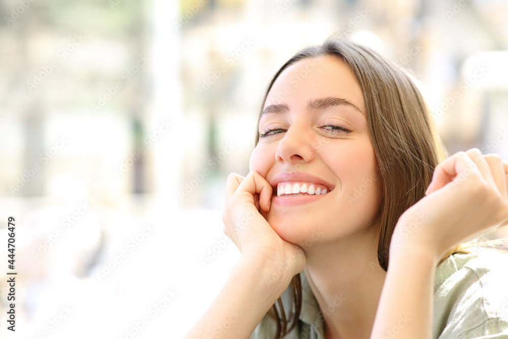 Happy woman with perfect smile posing looking at you Happy woman with perfect smile posing looking at you