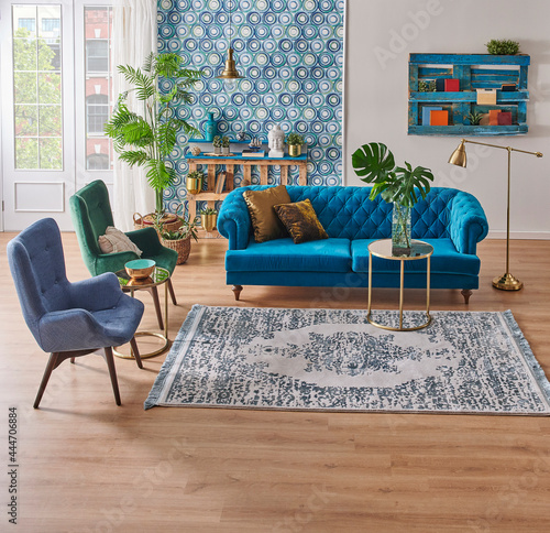 Modern living room furniture style with blue wallpaper and bookshelf for carpet style.