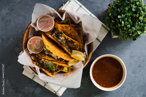 a bowl of delicious birria tacos; It's a dish that is very popular in Mexico that consist of goat meat or beef, stewed in perfection