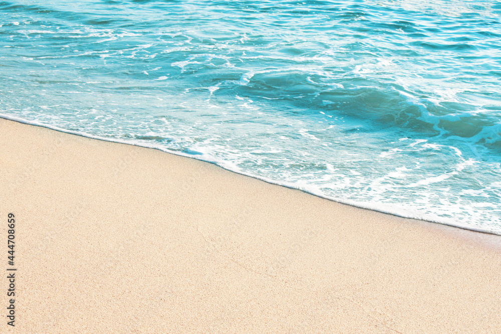 Soft blue ocean wave on sandy beach Soft blue ocean wave on sandy beach