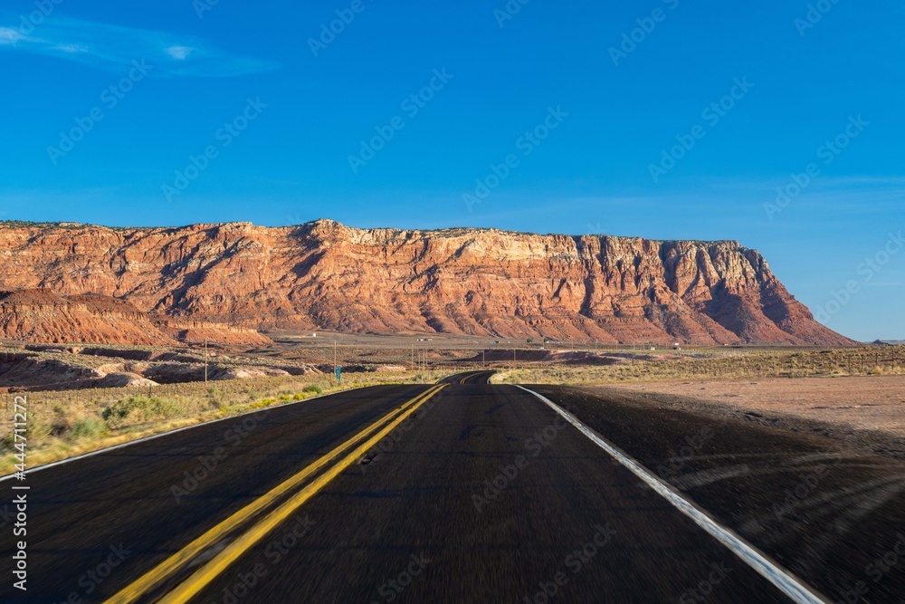 Fototapeta premium A long way down the road going to Glen Canyon National Recreation Area, Arizona