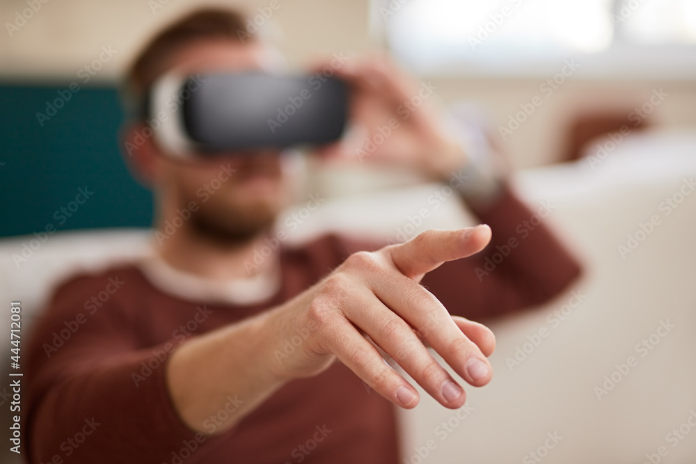 Unrecognizable man interacting with virtual reality