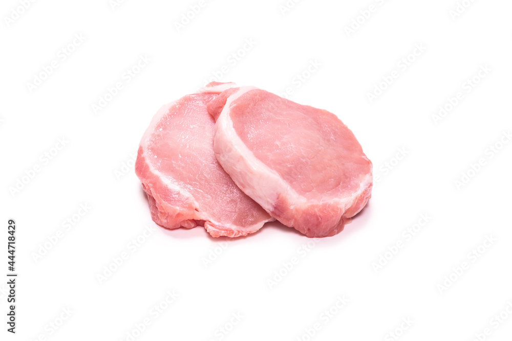 Raw pork pieces isolated on a white background.