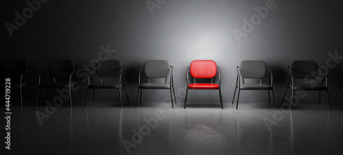 Red chair in spotlight. Job interview, recruitment concepts.