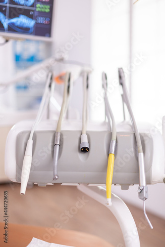 Professional medical stomatology teeth drill prepared for dentistry surgery during oral dental healthcare appointment. Empty orthodontics hospital office room equipped with surgeon tooth instruments