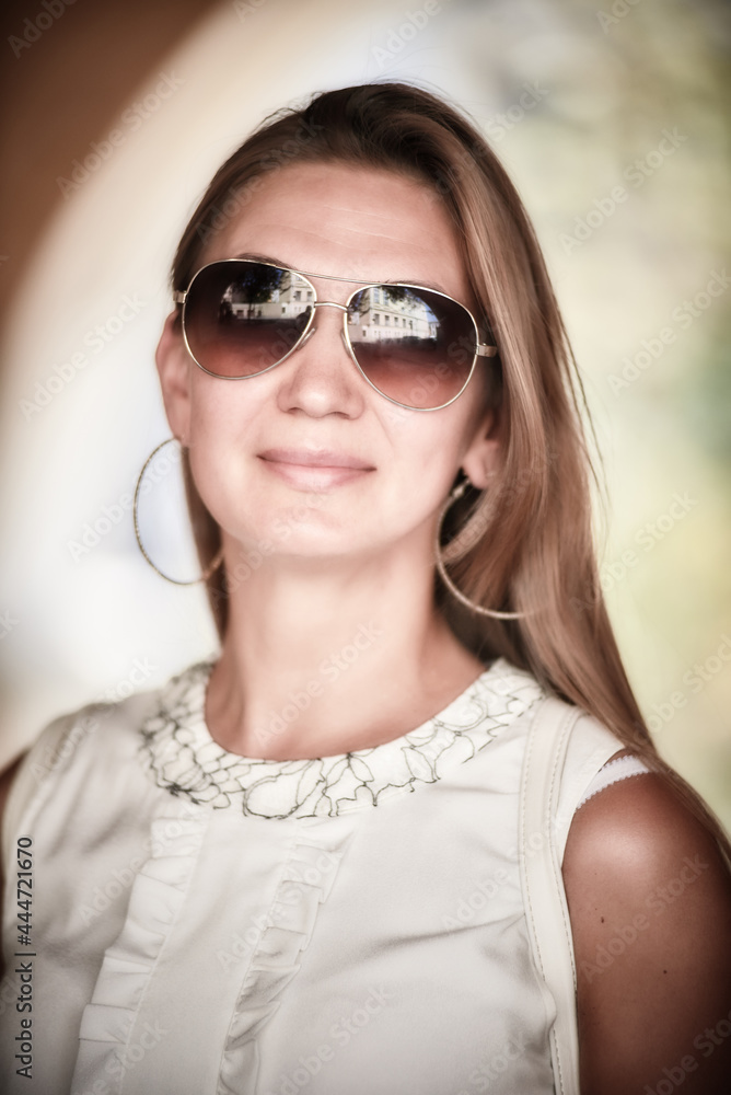 Young smiling woman in sunglasses Young smiling woman in sunglasses