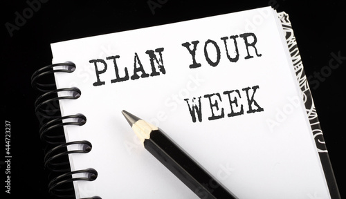 Wallpaper Mural Plan Your Week written text in small notebook on a black background Torontodigital.ca