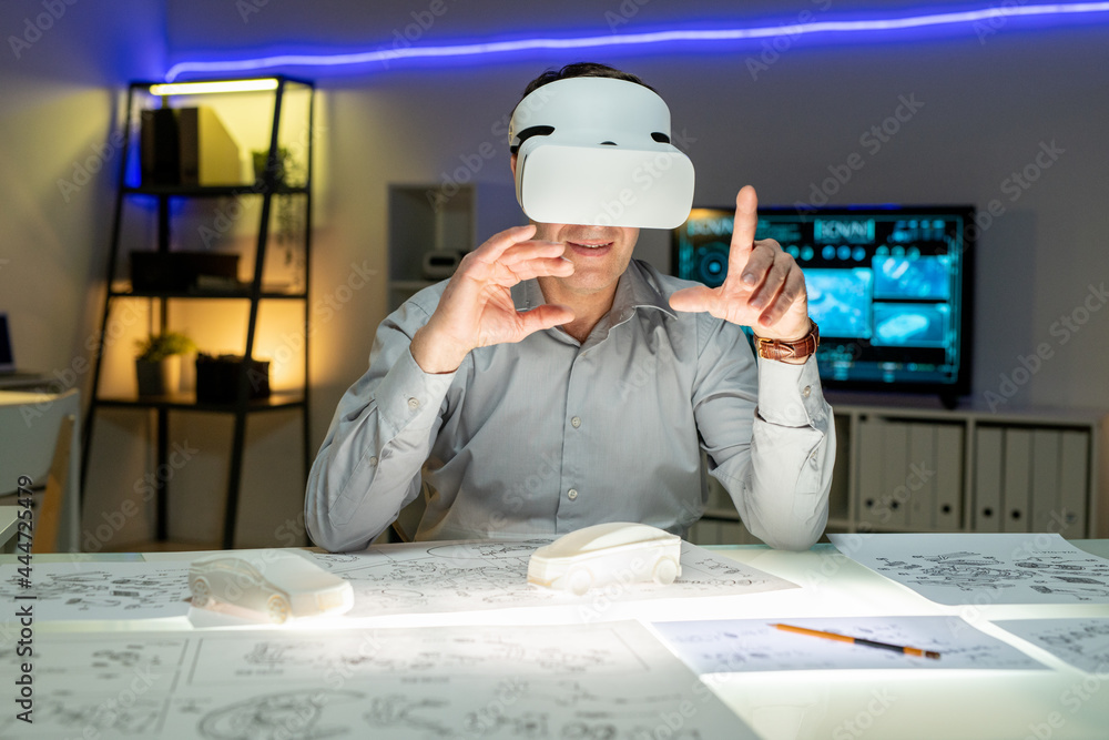Innovative Designer in VR Headset Working with Interactive Maquette Innovative Designer in VR Headset Working with Interactive Maquette
