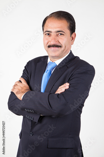 Company director CEO with moustache folding arms giving a pose portraiture
