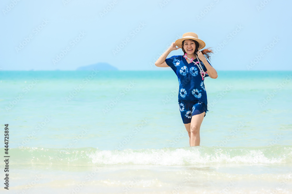 Summer vacations. Lifestyle woman relax and chill on beach background. Asia happy young people running on the wave sea, summer trips walking enjoy tropical beach. Lifestyle and Travel Concept. Summer vacations. Lifestyle woman relax and chill on beach background. Asia happy young people running on the wave sea, summer trips walking enjoy tropical beach. Lifestyle and Travel Concept.