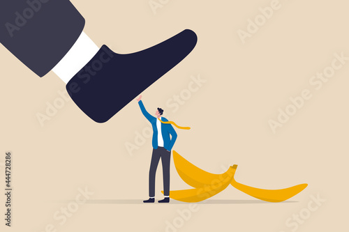 Avoid business mistake or failure, protect from accident or pitfall, insurance or warning in business risk and support in crisis concept, confidence businessman hero protect from slippery banana peel. photo